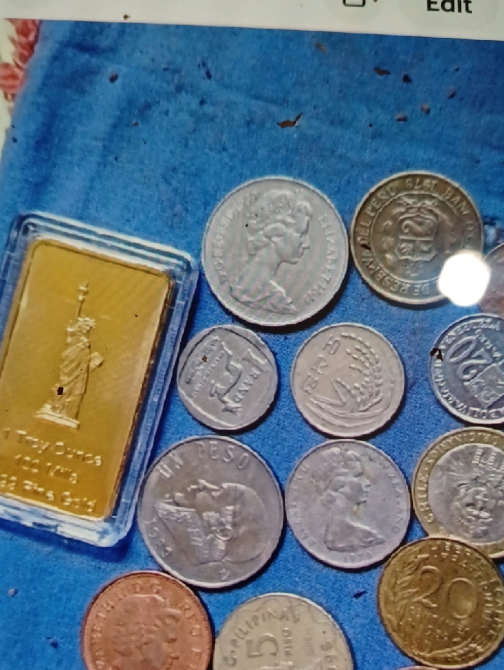 Gold Billion Plate Bar and Mixed World Coins - Blue Background